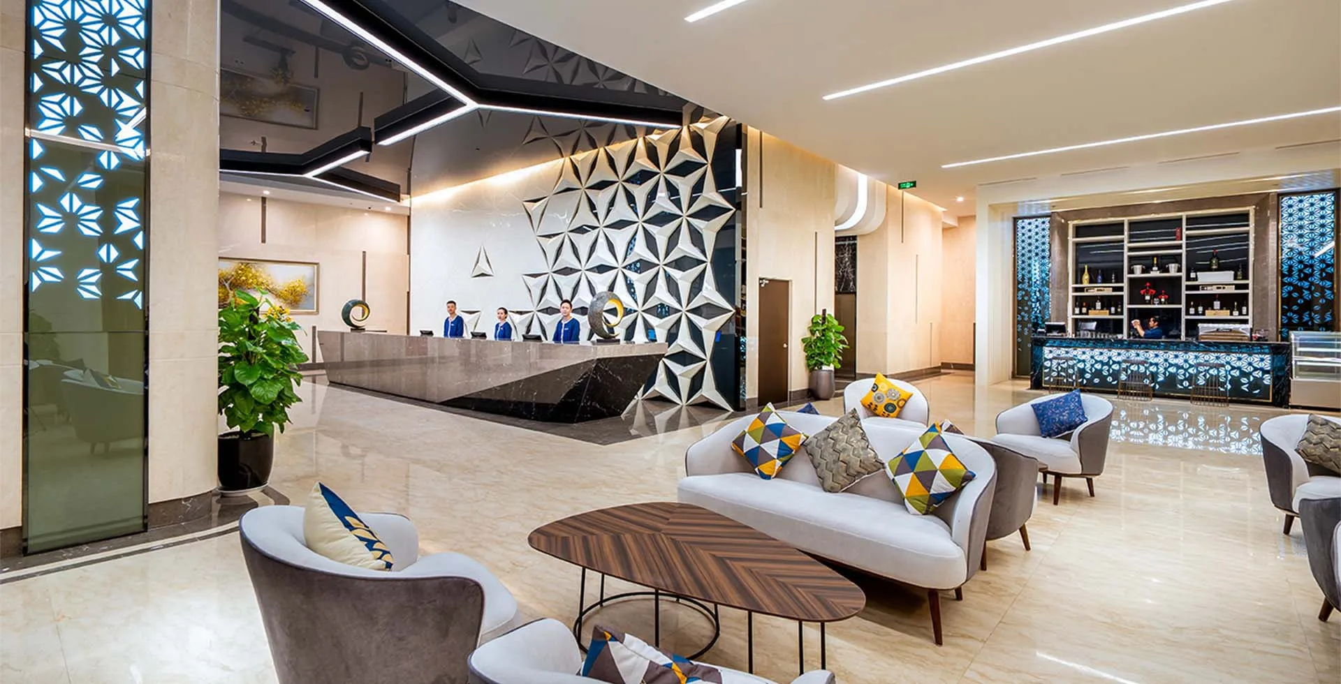 Lobby at Phat Linh Hotel in Ha Long City Vietnam with reception desk, seating area and modern wall design