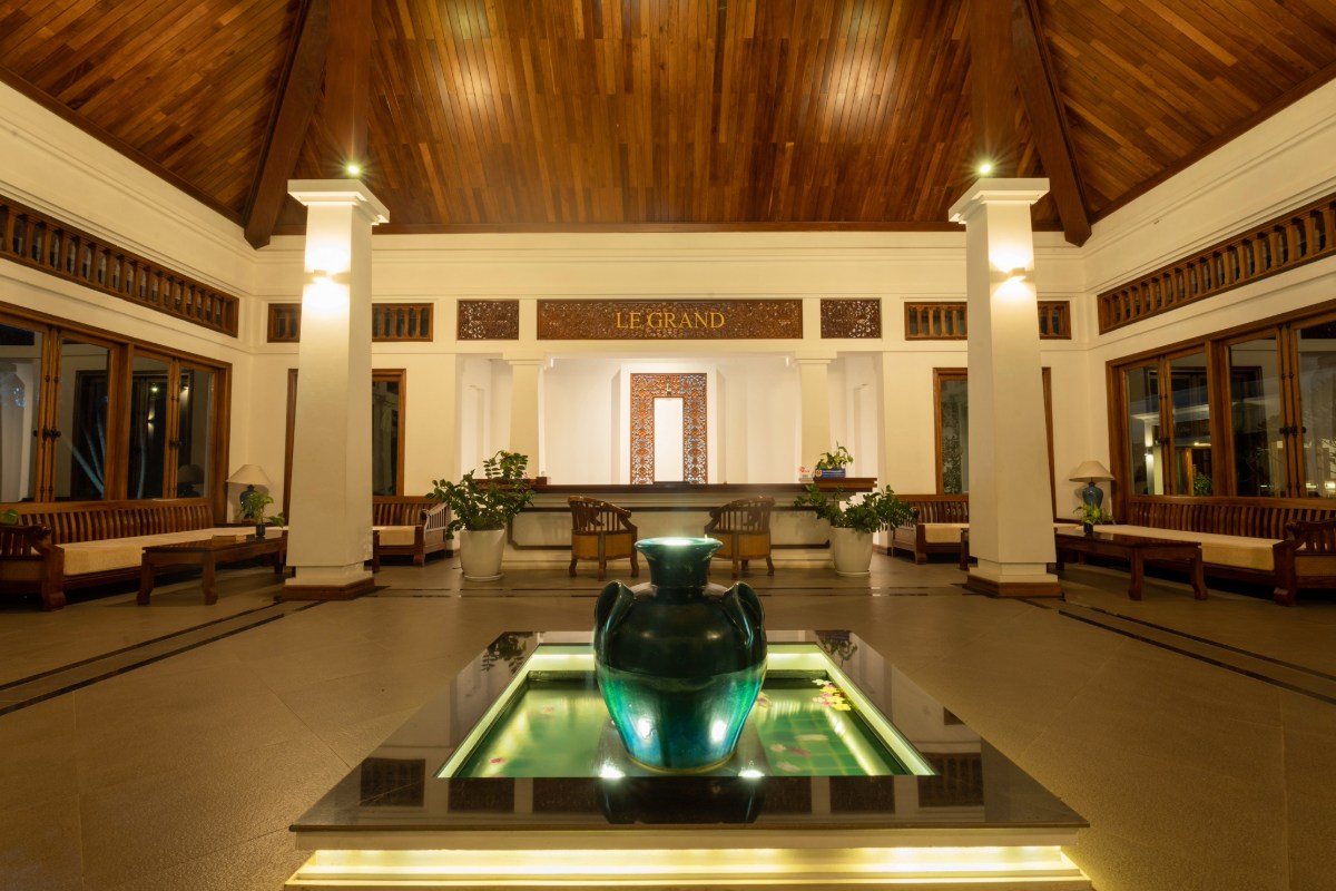 Lobby of Le Grand Pakbeng resort in Pak Beng Laos with decorative water basin and seating areas