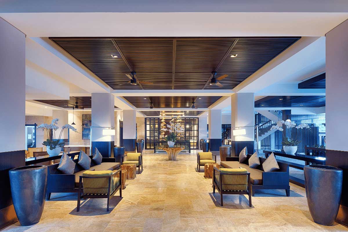 Lobby at Nam Nghi Coral Peninsula Phu Quoc Resort with seating areas and modern architecture