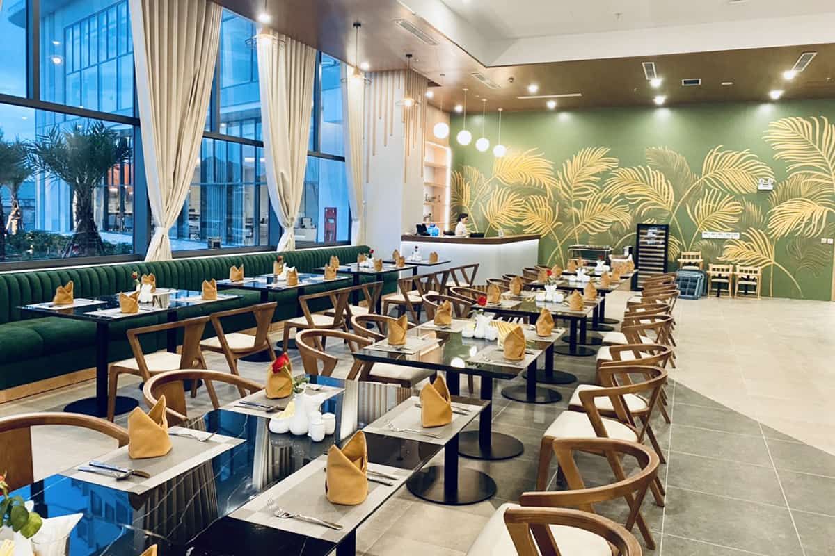 Restaurant area at Seabird Hotel Thien Cam in Ha Tinh with prepared tables and modern interior